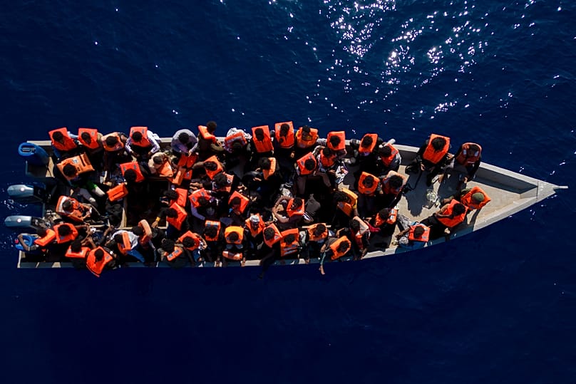 Migrants from Eritrea, Libya and Sudan sail a wooden boat before being assisted by aid workers of the Spanish NGO Open Arms in the Mediterranean Sea, 17 June, 2023