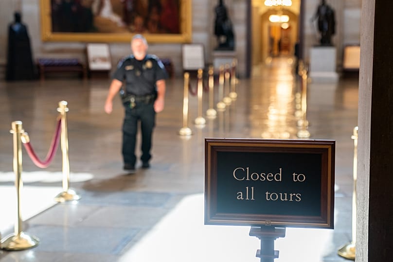 A sign reading "Closed to all tours" is displayed in the Capitol rotunda on the ninth day of the government shutdown Washington, Thursday, Oct. 9, 2025. (AP Photo/Allison Robb