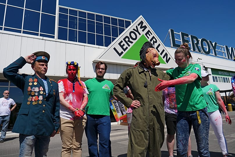 Activists take part in a protest outside an outlet of French home improvement retailer Leroy Merlin in Warsaw, 7 May, 2022