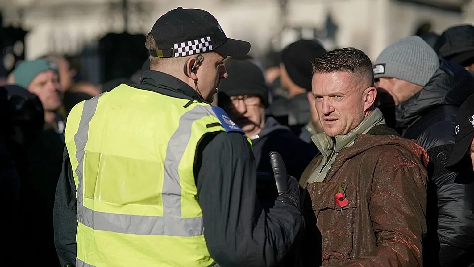 ILE: Far-right figurehead Tommy Robinson speaks to a police officer in London, UK, 11 November 2023 