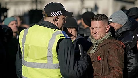 ILE: Far-right figurehead Tommy Robinson speaks to a police officer in London, UK, 11 November 2023 