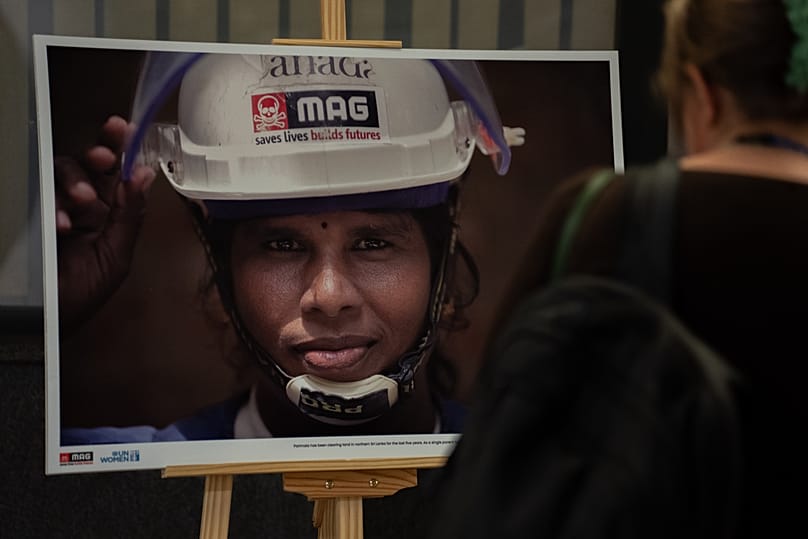A photograph of a deminer in Sri Lanka by Maryam Ashrafi, in collaboration with MAG, as part of the joint photo exhibition in Brussels, Belgium. 4 Nov, 2025. 