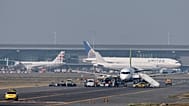Security personnel search an aircraft on the tarmac at Brussels International Airport, 1 October, 2025