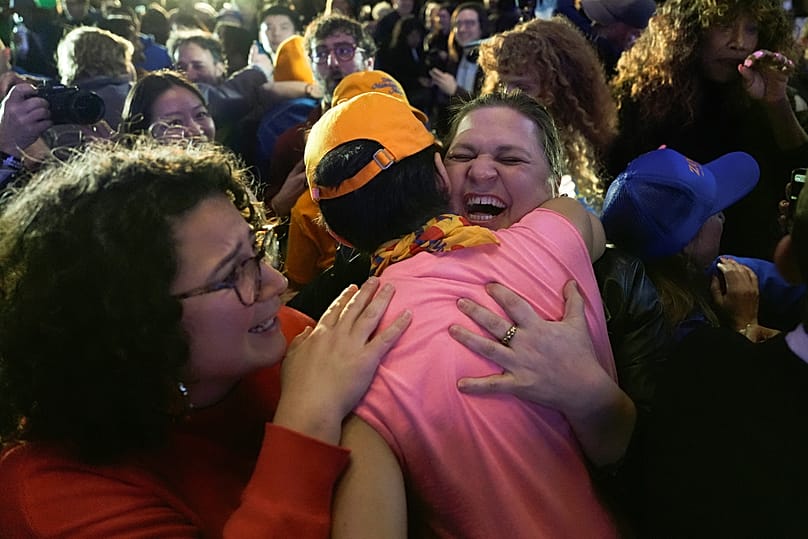 Supporters for Democratic mayoral candidate Zohran Mamdani react as they watch returns during an election night watch party, Tuesday, Nov. 4, 2025, in New York.