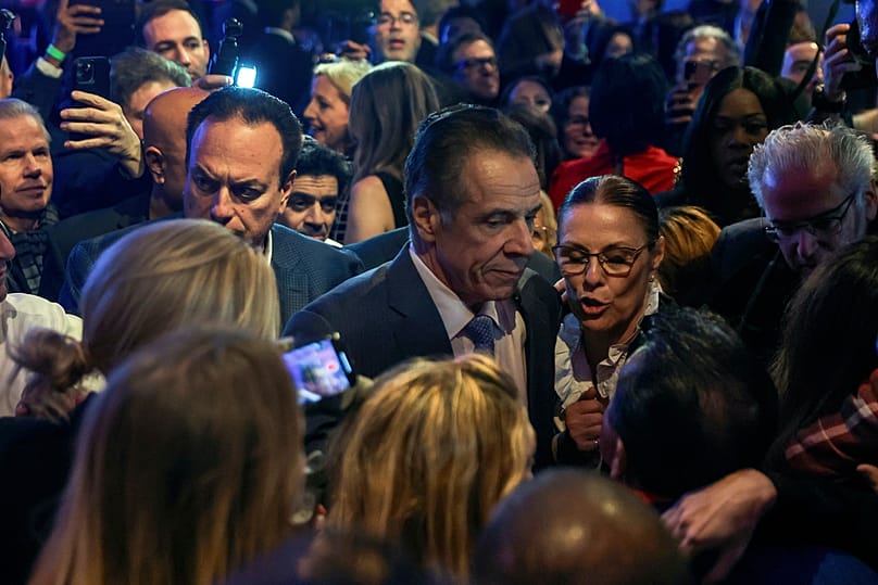 Andrew Cuomo talks with supporters after conceding the mayoral election to Zohran Mamdani, Tuesday, Nov. 4, 2025, in New York. (AP Photo/Heather Khalifa)