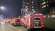 Firefighters stand guard in front of a nursing home after a fire in Tuzla, Bosnia, Tuesday, Nov. 4, 2025. (AP Photo)