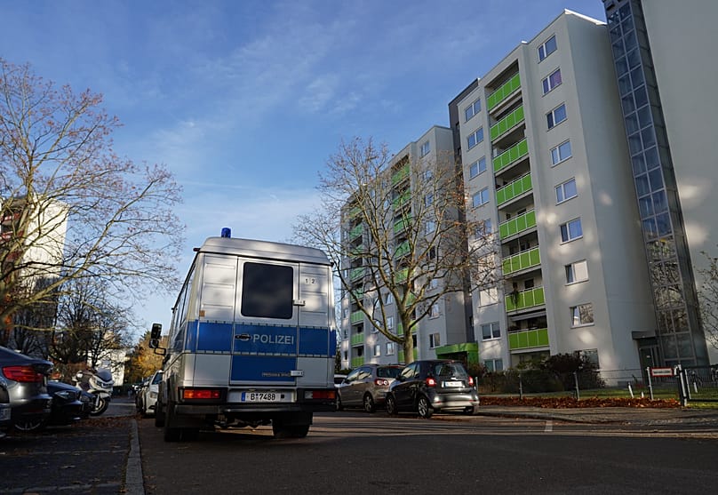 Police officers carry seized material from an apartment in the Mümmelmannsberg district after a raid in Hamburg, 5 November, 2025