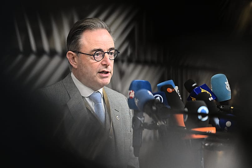Belgium's Prime Minister Bart De Wever speaks with the media as he arrives for an EU Summit at the European Council building in Brussels, 23 October, 2025