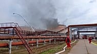 Firefighters work at the site of an oil refinery facility, near the city of Ukhta, Komi Republic of Russia, June 2, 2024