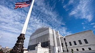 An American flag flies at half-staff outside the Supreme Court on Wednesday, 5 November 2025, in Washington.