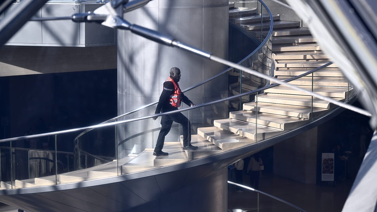 FILE: A member of security climbs up the stairs in the Louvre museum in Paris, 30 October 2025