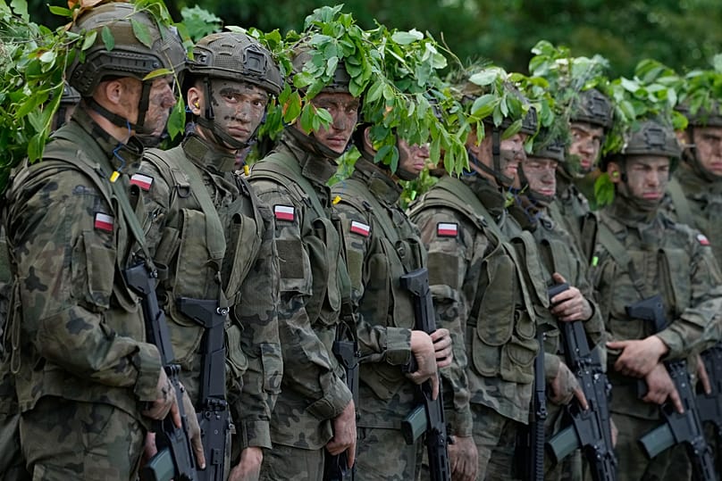 Volunteers in Poland's army practice shooting during training exercises in Nowogrod, 20 June, 2024