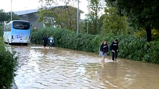 Flooded roads and people with water up to their ankles