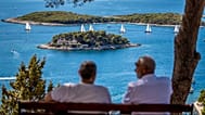 Two men overlook a view in Hvar, Croatia 