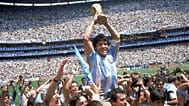 Diego Maradona holds up his team's trophy after Argentina's 3-2 victory over West Germany at the World Cup final match, 29 June 1986