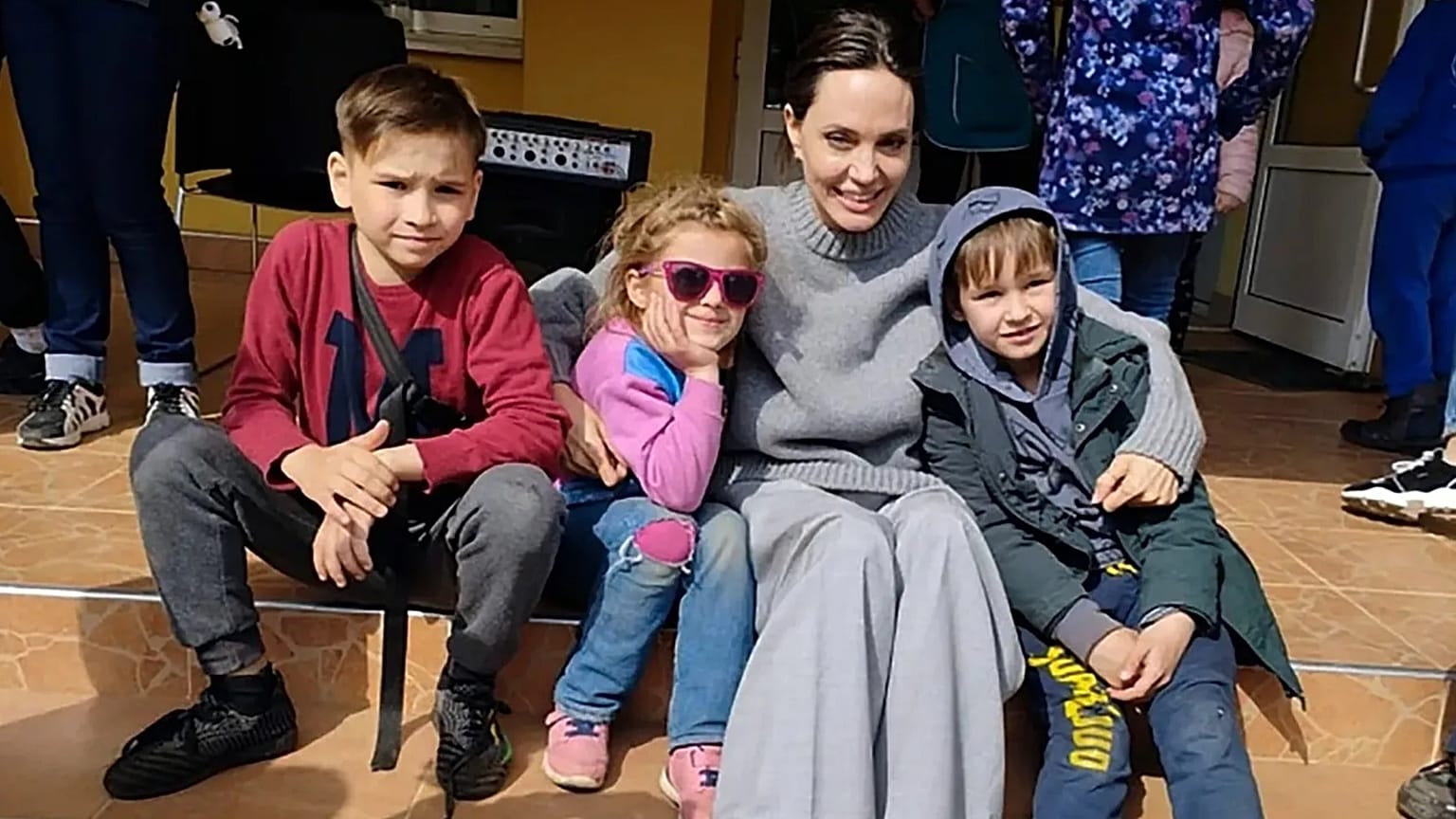 Angelina Jolie, Hollywood movie star and UNHCR goodwill ambassador, poses for photo with kids in Lviv, Ukraine, Apr. 30, 2022. 