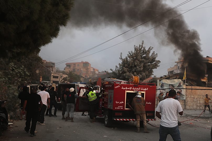 Smoke rises following an Israeli airstrike in the village of Teir Debba, southern Lebanon, Thursday, Nov. 6, 2025. (AP Photo/Mohammad Zaatari)