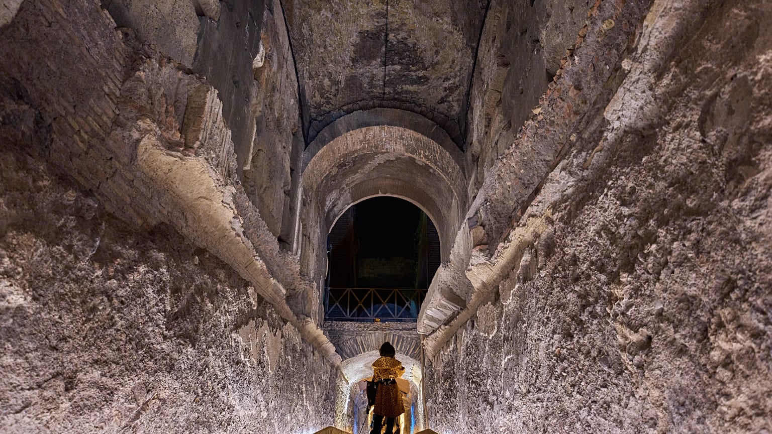 A journalist scans the 'Commodus Passage' built underneath the Colosseum in Rome, Tuesday, Oct. 21, 2025.