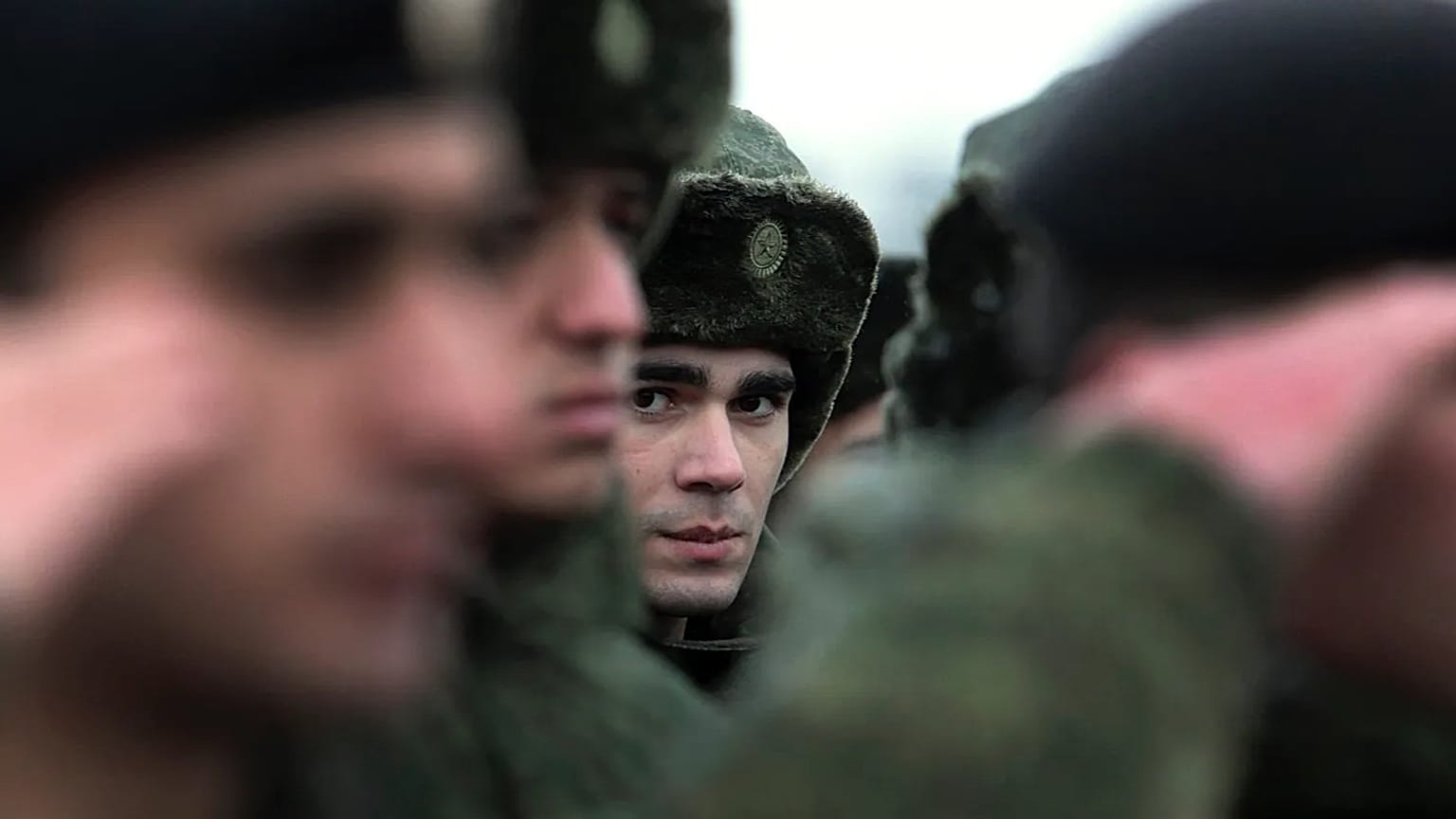 FILE - In this Monday, Nov. 17, 2014, file photo, conscripts stand at a military conscription office in Grozny, Chechnya's provincial capital, Russia