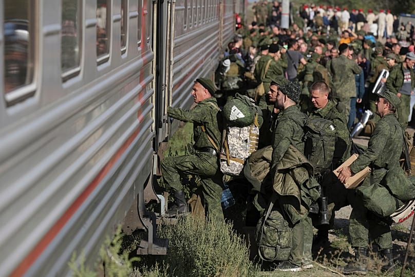 FILE FILE - Russian recruits take a train at a railway station in Prudboi, Volgograd region of Russia, Sept. 29, 2022. 