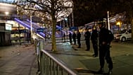Des policiers sécurisent le Stade de France lors du match de football entre la France et l'Allemagne, le vendredi 13 novembre 2015, à Saint-Denis, près de Paris.