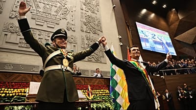 President Rodrigo Paz, right, and Vice President Edman Lara hold hands after the swearing-in ceremony in La Paz, Bolivia, Saturday, Nov. 8, 2025