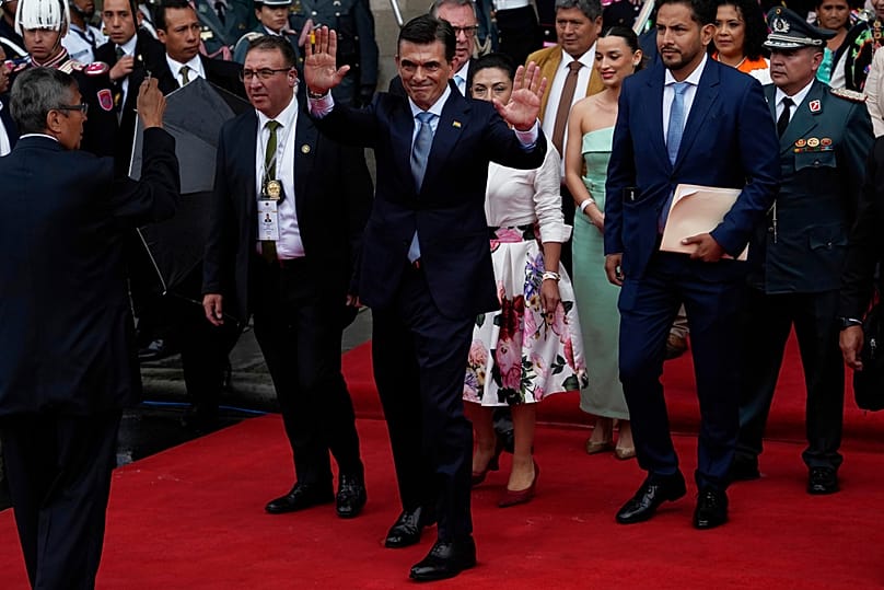 Rodrigo Paz, center, heads to the National Congress for his swearing-in ceremony in La Paz, Bolivia, Saturday, Nov. 8, 2025