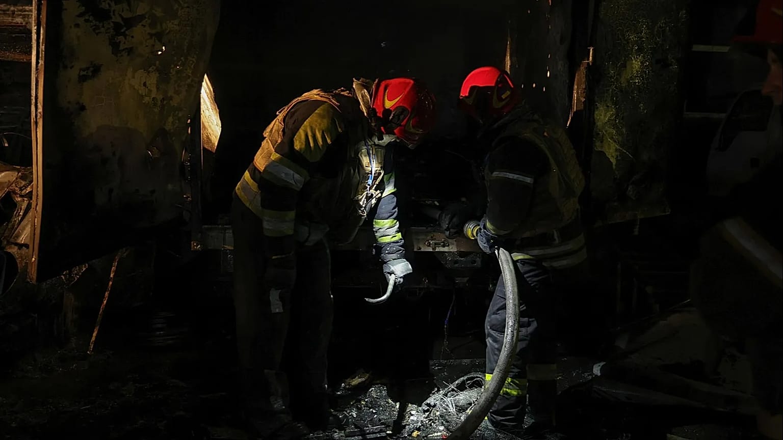 Firefighters at the site of the downing of a Russian UAV in Kiev