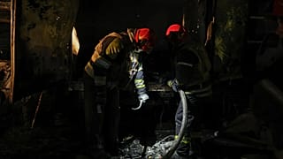 Firefighters at the site of the downing of a Russian UAV in Kiev