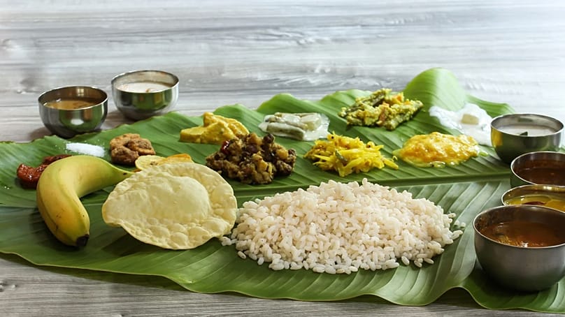 A traditional Onam Sadya feast served on a banana leaf