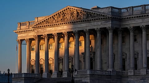 The House of Representatives at the Capitol is illuminated at dawn in Washington, Oct. 6, 2025.