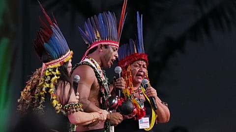 Indigenous people perform during COP30 in Brazil. 