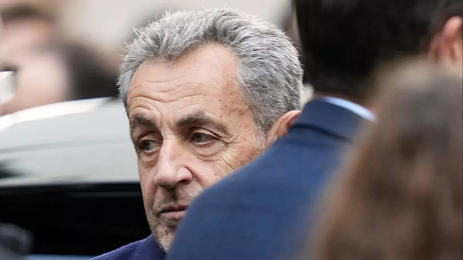 Former French President Nicolas Sarkozy reacts before entering a police car in Paris, 21 October, 2025