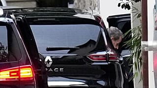 Former French President Nicolas Sarkozy leaves his car as he arrives at his home after being released from prison in Paris, 10 November, 2025 