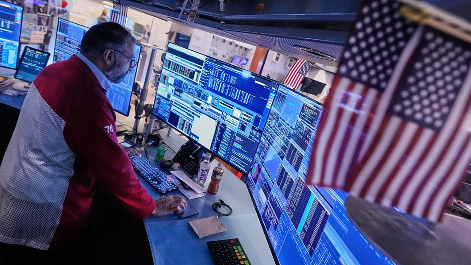 File - Trader Aman Patel works on the floor of the New York Stock Exchange. 6 November 2025