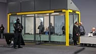 Defendant Taleb al-Abdulmohsen sits in a bullet-proof glass box in the courtroom in a temporary court building in Magdeburg, 10 November 2025