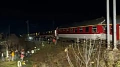 In this image made from video provided by Slovakia's Fire Service, passengers are guided by emergency services after a train crash in Pezinok, 9 November 2025.