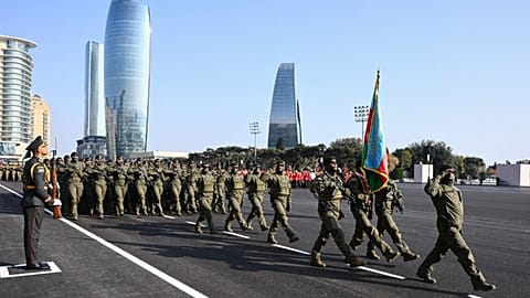 In this photo provided by Azerbaijan's Presidential Press Service, participants of a military parade march in Baku, Nov. 8, 2025,