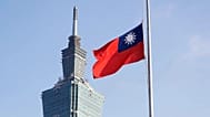 A Taiwan national flag flutters near the Taipei 101 building at the National Sun Yat-Sen Memorial Hall in Taipei, 28 February, 2025