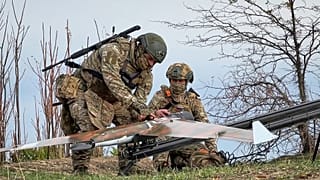 Russian soldiers prepare a drone for reconnaissance of Ukrainian positions in an undisclosed location in Ukraine, 6 November, 2025