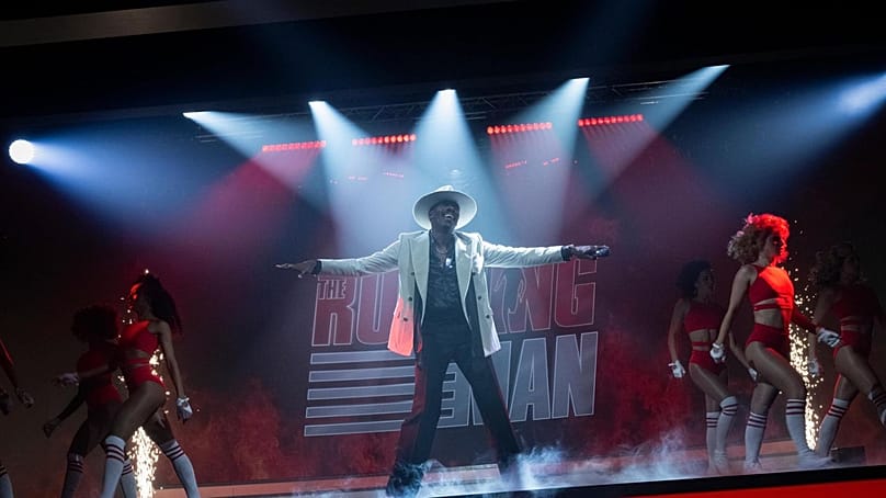 Colman Domingo as the flamboyant host of The Running Man fictional game show.