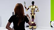 An exhibitor gives command to a robot at Nvidia's booth during a conference in Beijing, China, on July 18, 2025.