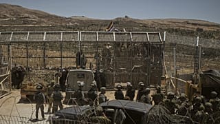 Izraeli katonák a Golán-fennsíkon, a szíriai határnál júliusban