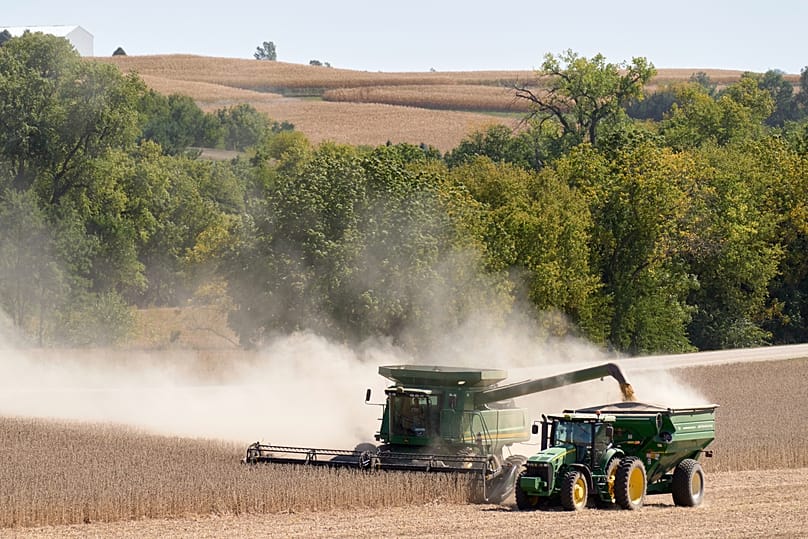 A combine harvests soy beans in Bennington, Neb., Tuesday, Sept. 29, 2020. 