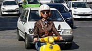Merat Behnam drives her motorbike in downtown Tehran