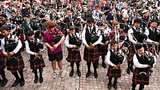 Bagpipers gather to break a world record for the largest ever bagpipe ensemble playing "It's a Long Way to the Top" by Australian rock band AC/DC in Melbourne,