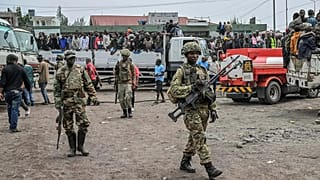 M23 rebels escort government soldiers and police who surrendered to an undisclosed location in Goma, 30 January, 2025