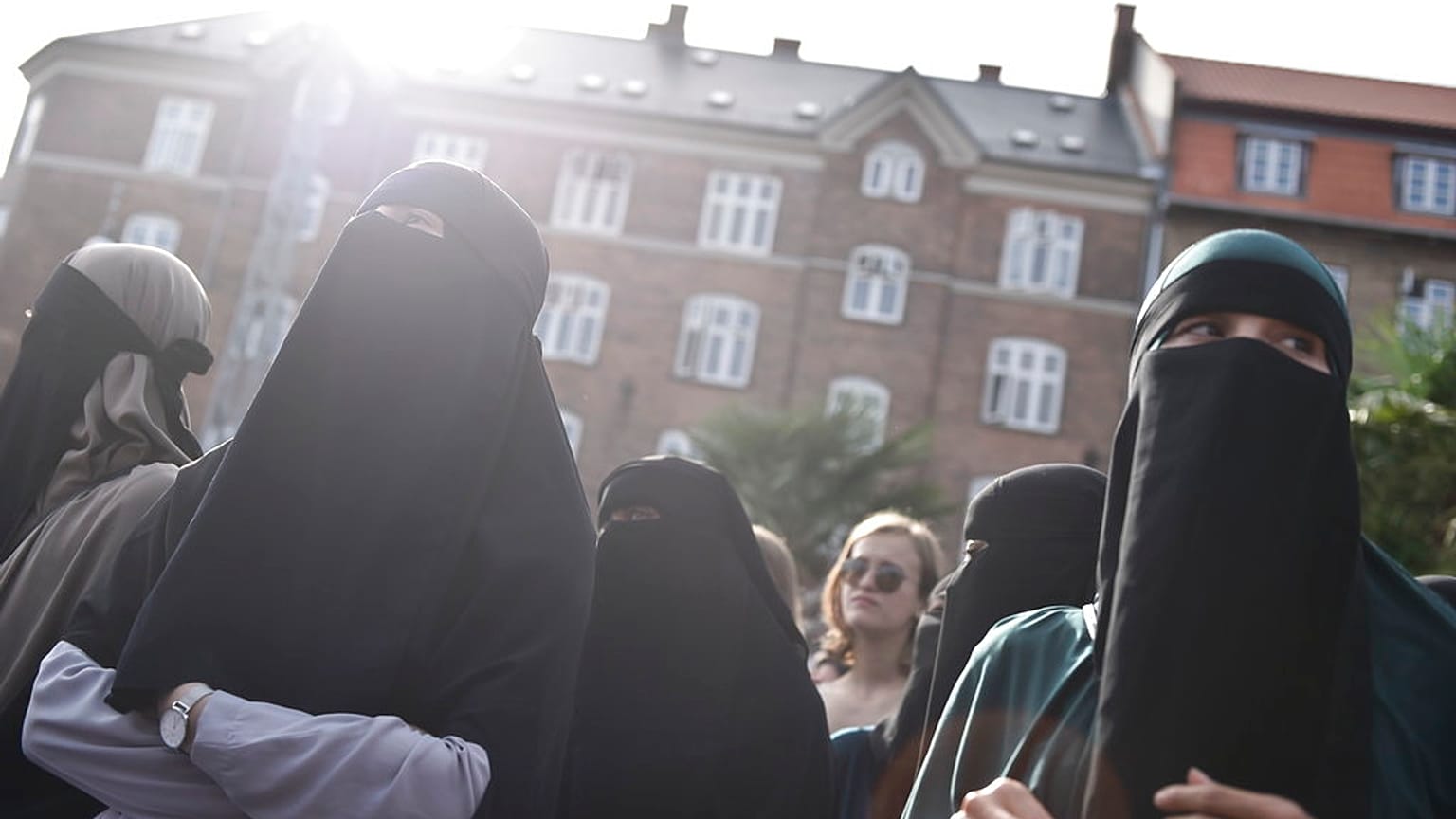 FILE - People demonstrate in Copenhagen, Denmark, Wednesday 1 August 2018, against a ban on face veils