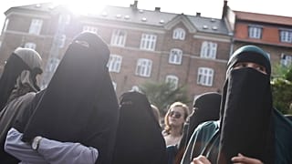 FILE - People demonstrate in Copenhagen, Denmark, Wednesday 1 August 2018, against a ban on face veils