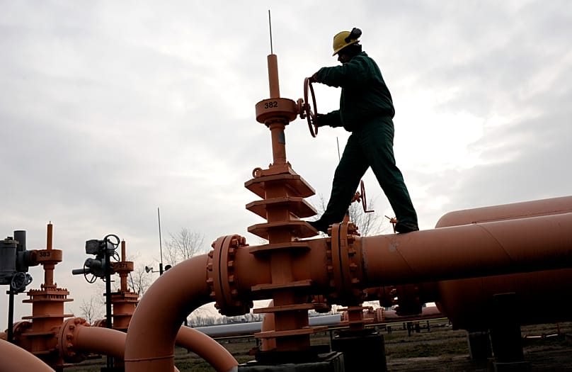 An employee of the Hungarian Mol Natural Gas Transporting Corp. checks the pressure in the pipeline forwarding Russian natural gas from Ukraine at the gas receiving station in
